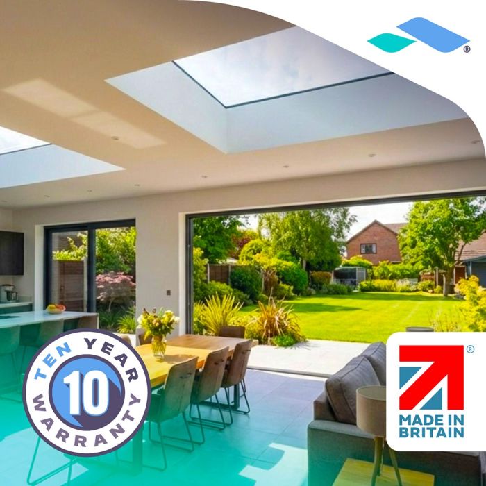Dining area lit by a Skyseal flat roof skylight, with garden view
